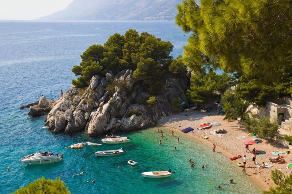 scenic-beach-clear-water-boats-croatia