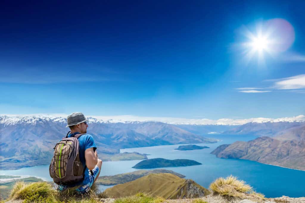Tourist,With,A,Backpack,And,Mountain,Panorama